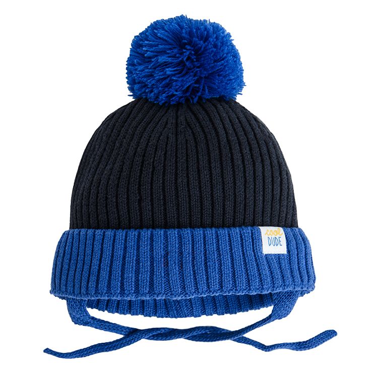 Blue and black cap with pom pom