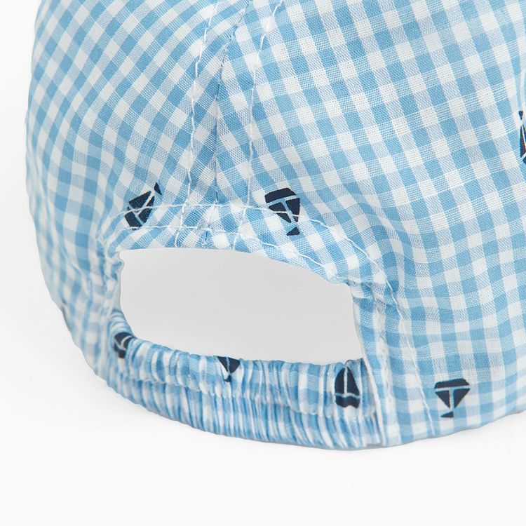 Blue and white checkered jockey hat with small sailing boats print