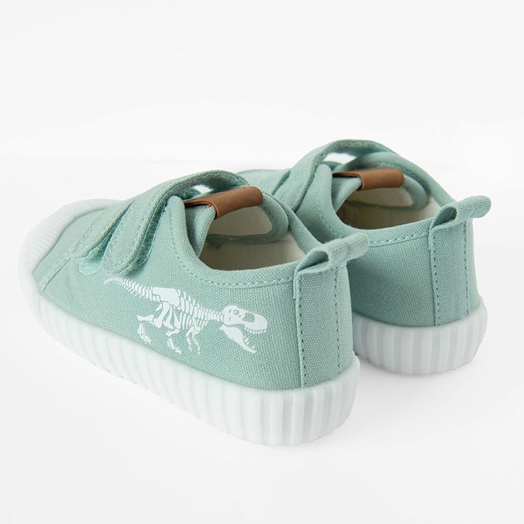 Green canvas sneakers with scratch and dinosaur print