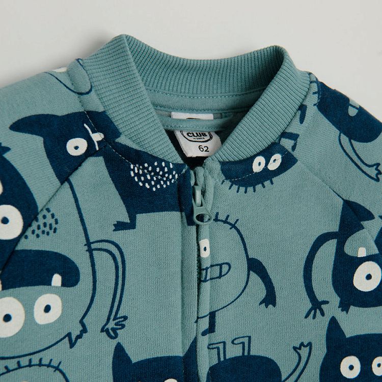 Light blue zip through sweatshirt with monsters print