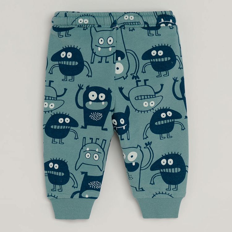 Light blue jogging pants with monsters print