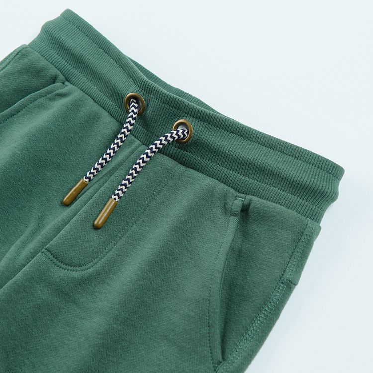 Dark green jogging pants