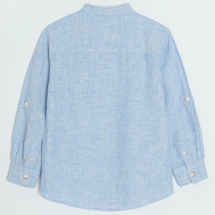 Light blue denim long sleeve button down shirt that rolls up to a button