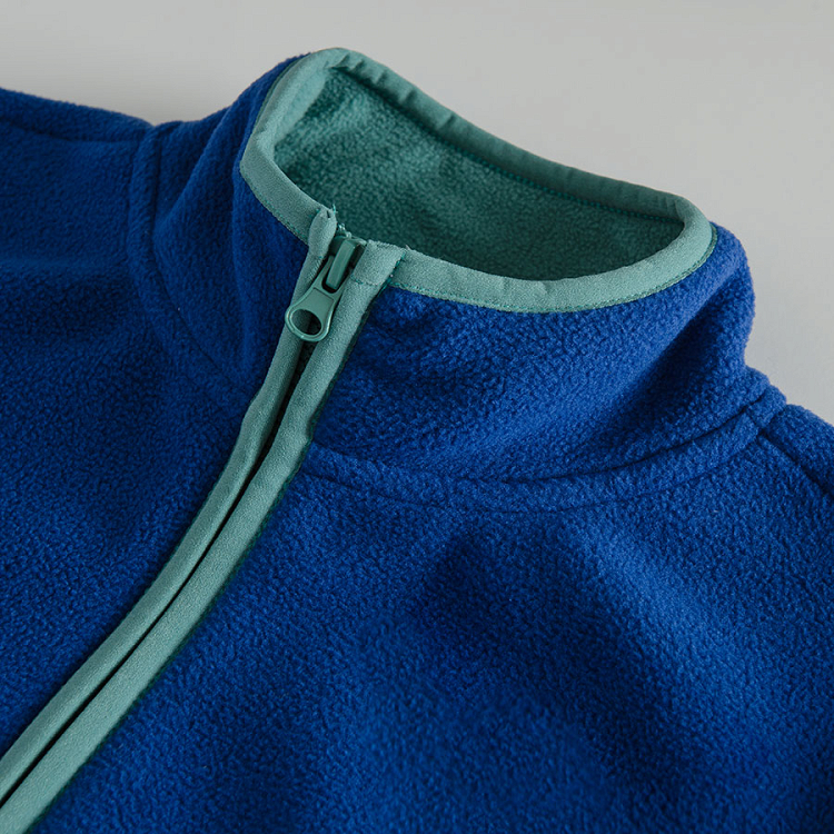 Blue zip through sweatshirt with green finishes