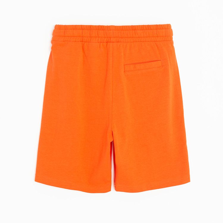 Orange bermuda shorts with cord on the waist