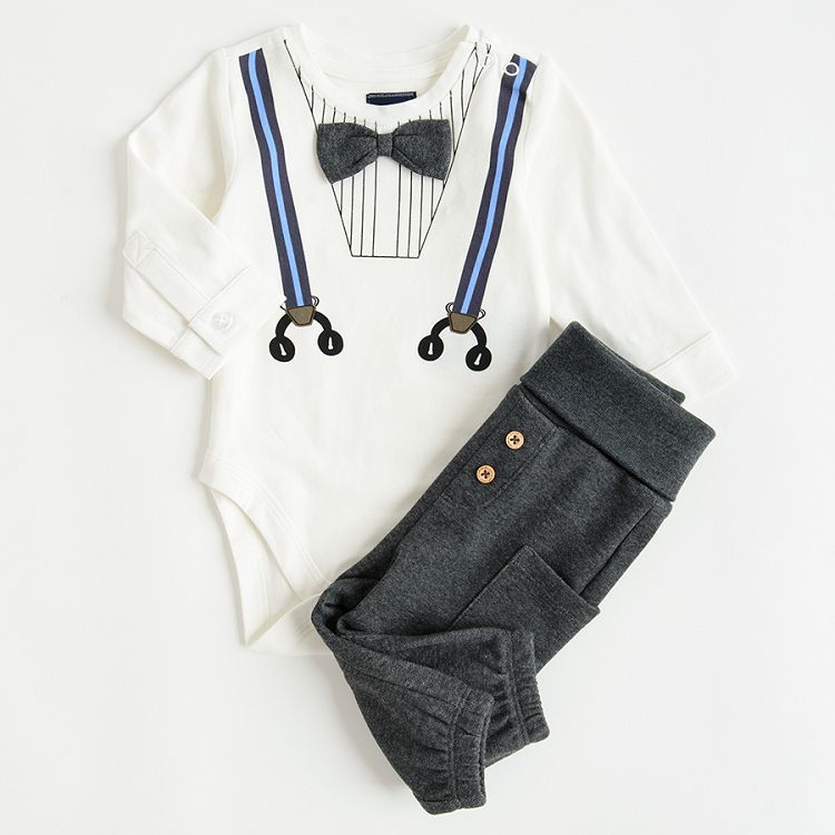 White long sleeve bodysuit with suspenders and bow tie print and grey jogging pants with external pockets