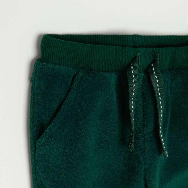 Green jogging pants