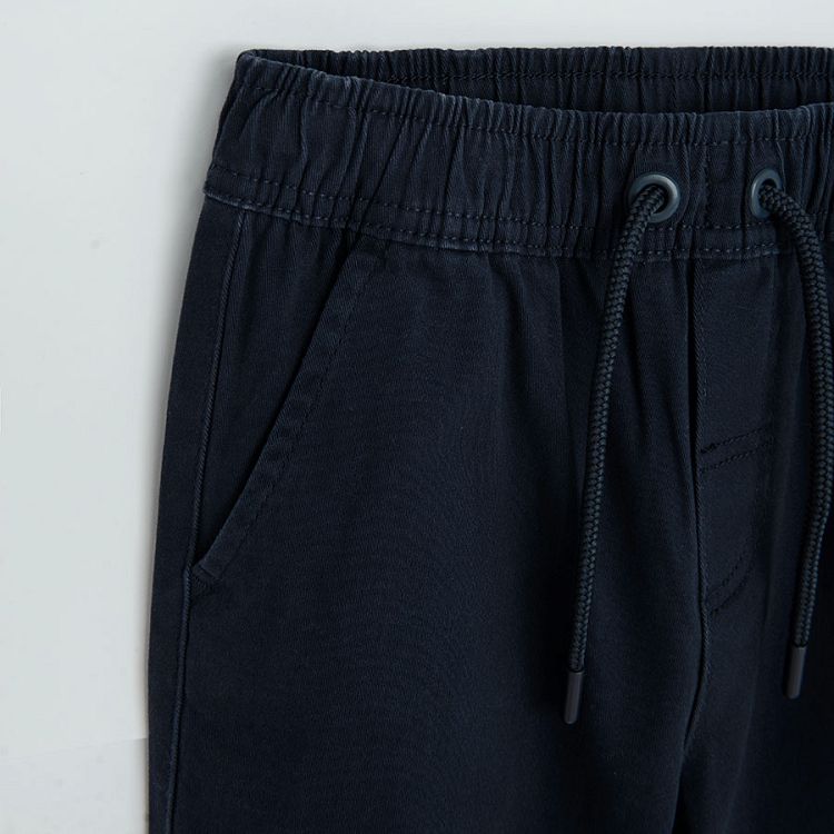 Dark blue trousers with cord on the waist