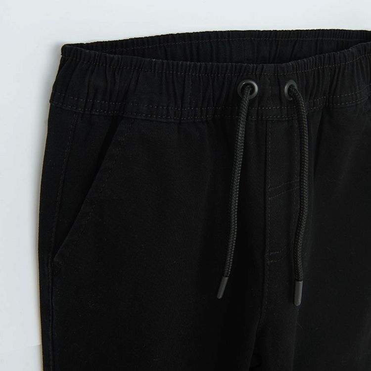 Black trousers with elastic cord on the waist