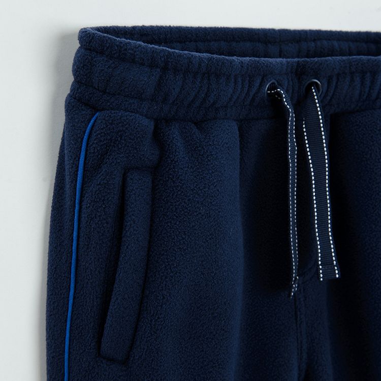 Blue jogging pants with cord on the waist