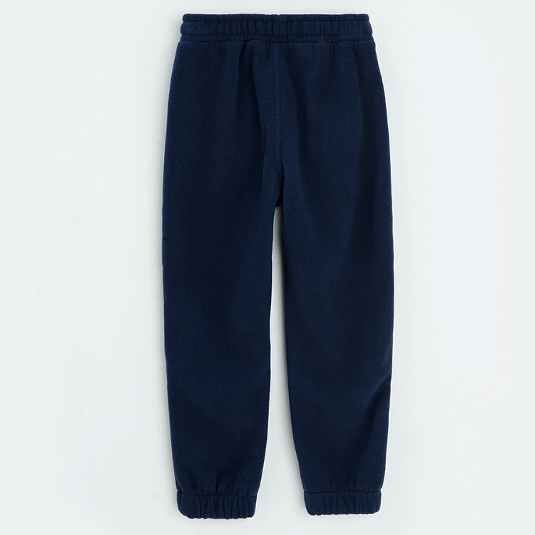 Blue jogging pants with cord on the waist