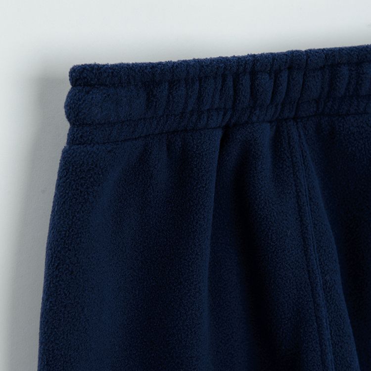 Blue jogging pants with cord on the waist