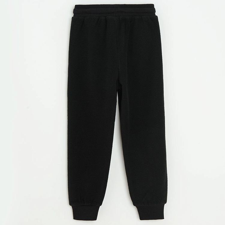 Black jogging pants with orange side stripe