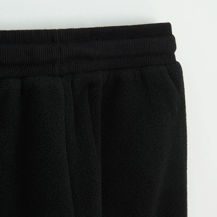 Black jogging pants with orange side stripe