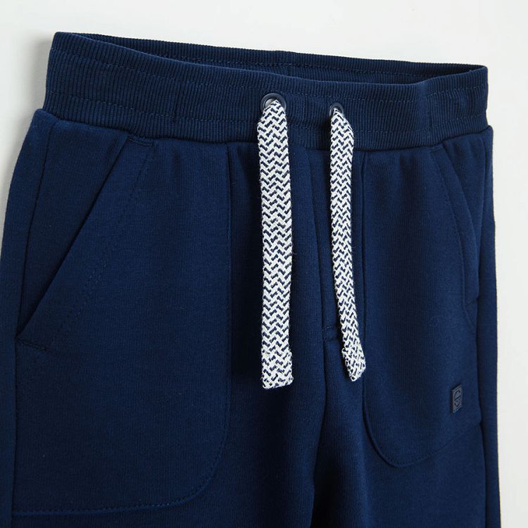 Blue jogging pants with cord on the waist