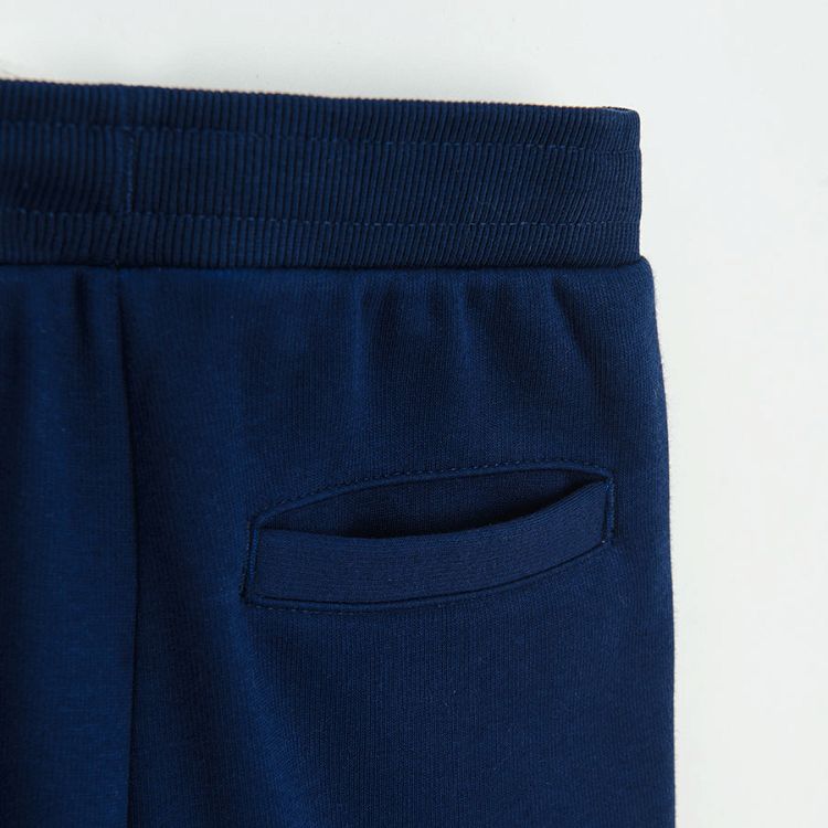 Blue jogging pants with cord on the waist