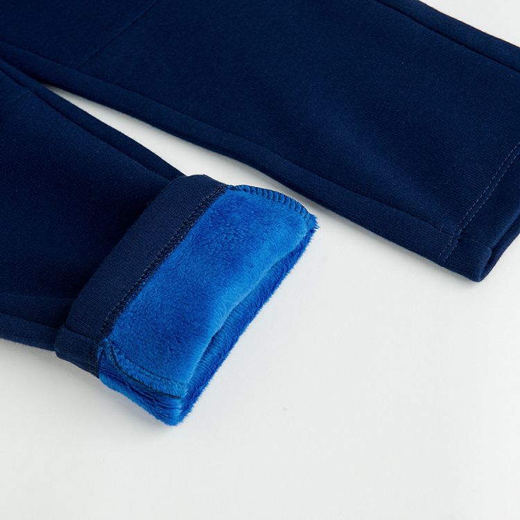 Blue jogging pants with cord on the waist