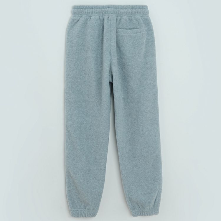 Grey fleece jogging pants with blue line on the side