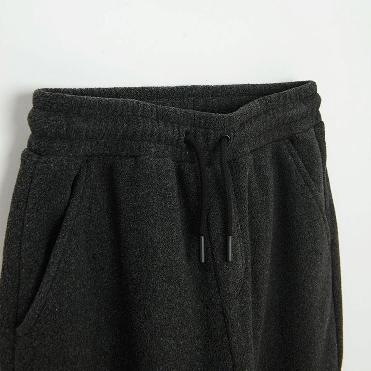 Grey jogging pants with pocket on the left leg