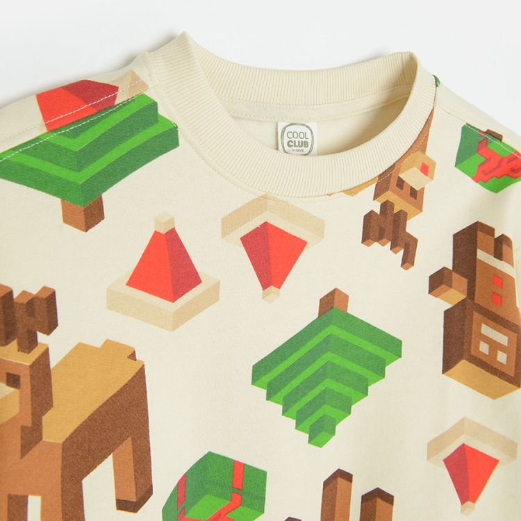 White sweatshirt with raindeer, cookies and christmas trees prints made of building blocks