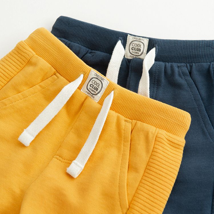 Blue and yellow sweatapants with cord