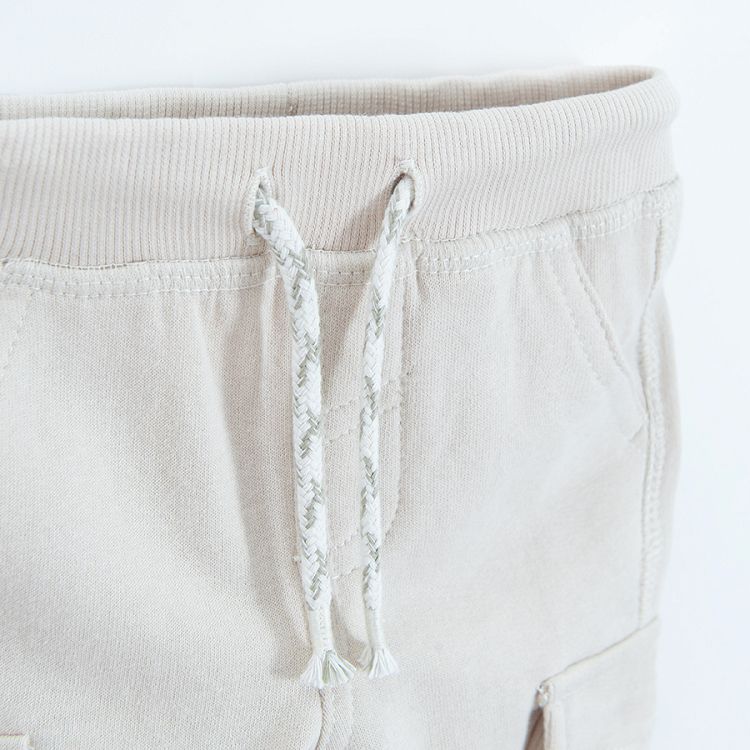 Beige cargo style sweatpants with cord