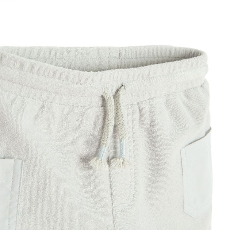 Light grey shorts with side pockets