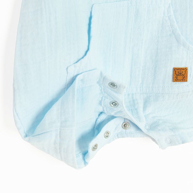 Light blue short sleeve romper with buttons and side pockets