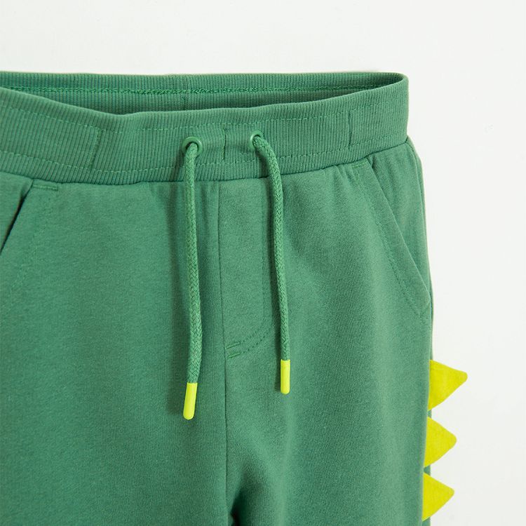 Green sweatpants with dinosaurs style