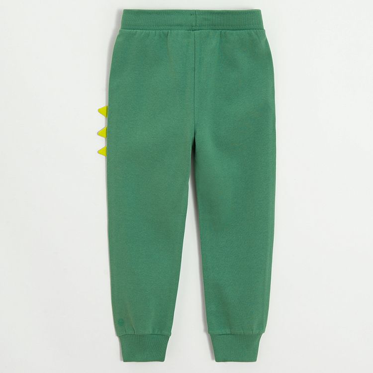 Green sweatpants with dinosaurs style