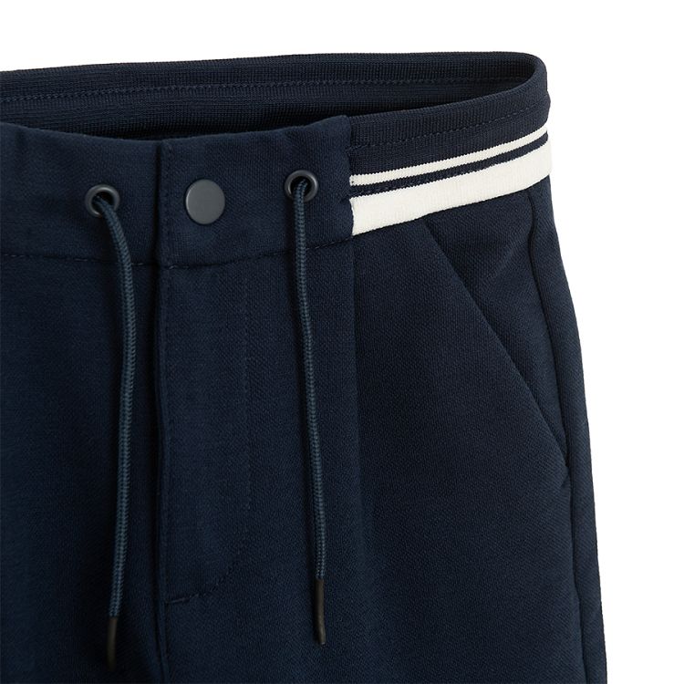 Dark blue trousers with cord