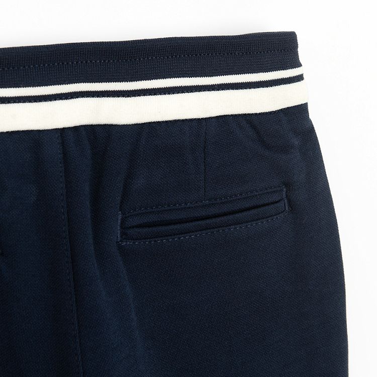 Dark blue trousers with cord