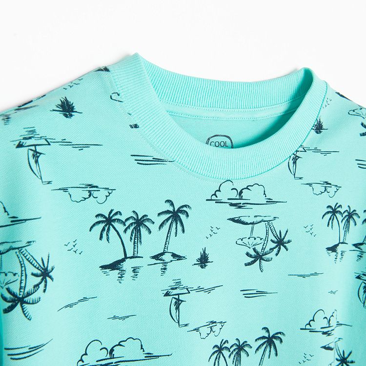 Blue polo T-shirt with palm trees print