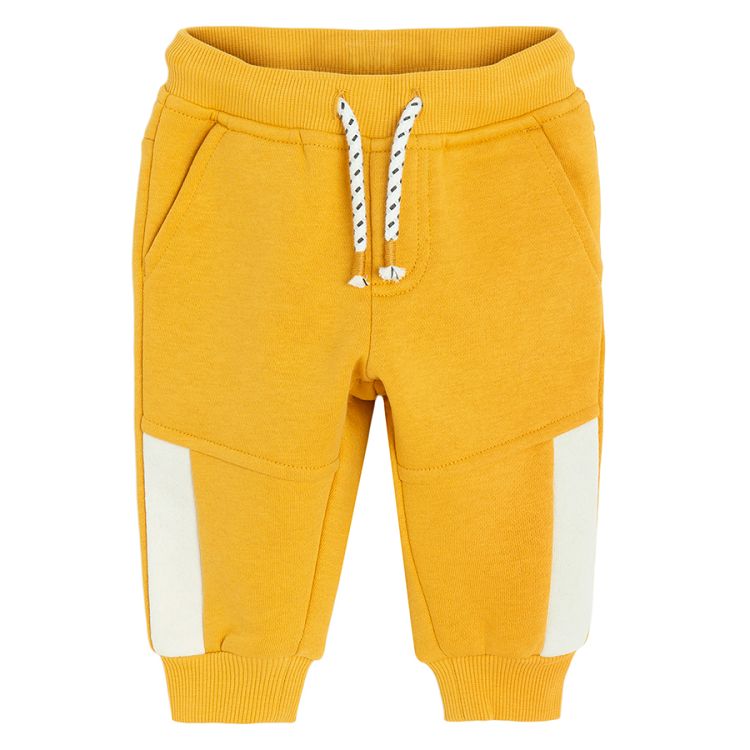 Yellow jogging pants with corded waist and elastic around the ankles