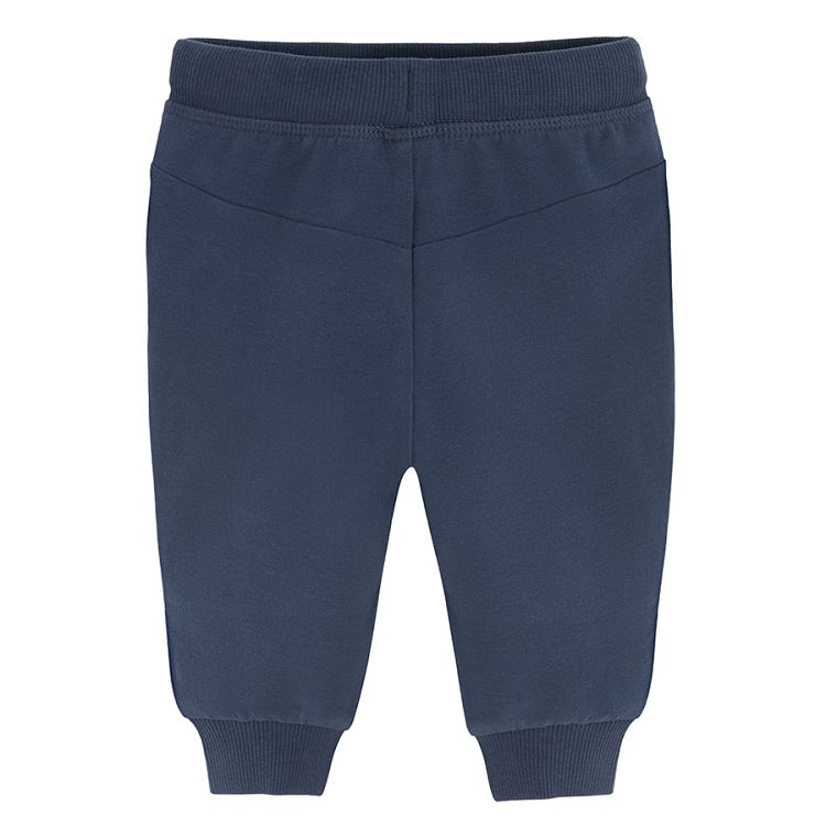 Dark blue jogging pants with monster face on the knees print