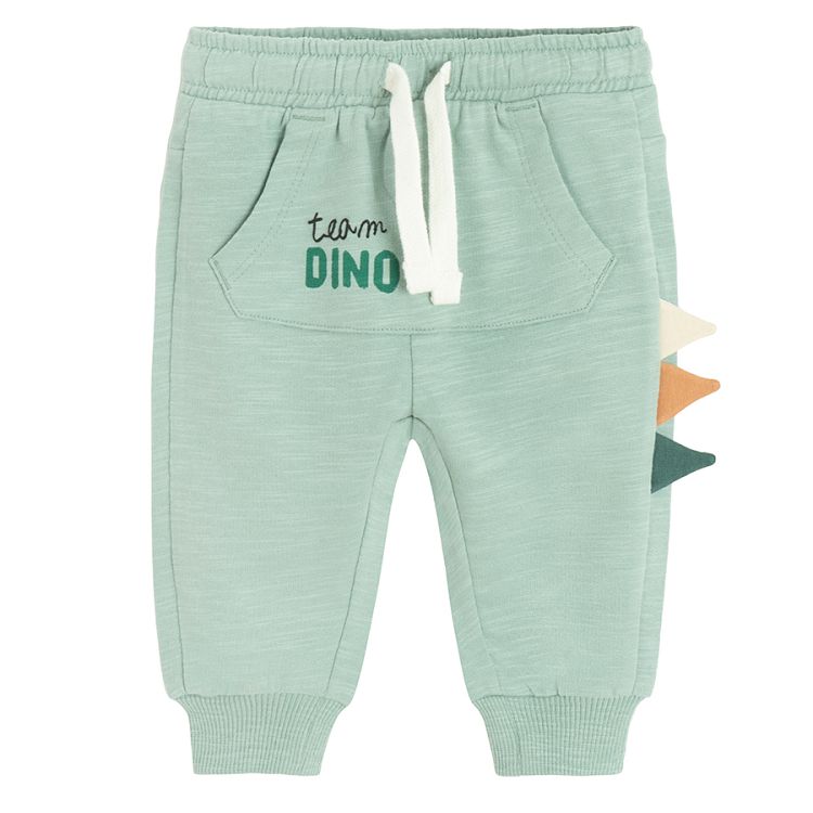 Light blue jogging pants with dinosaur's scales on the side