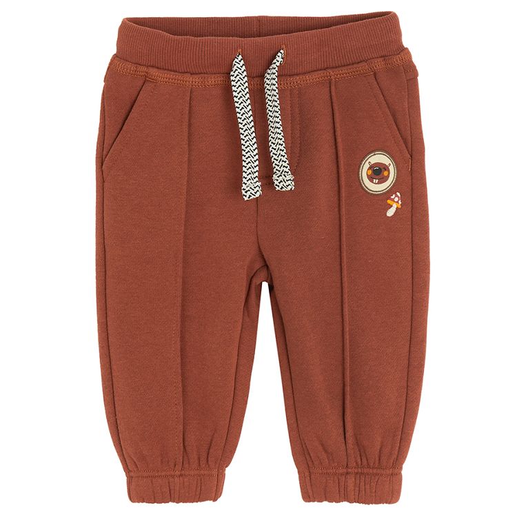 Brown jogging pants with bear print