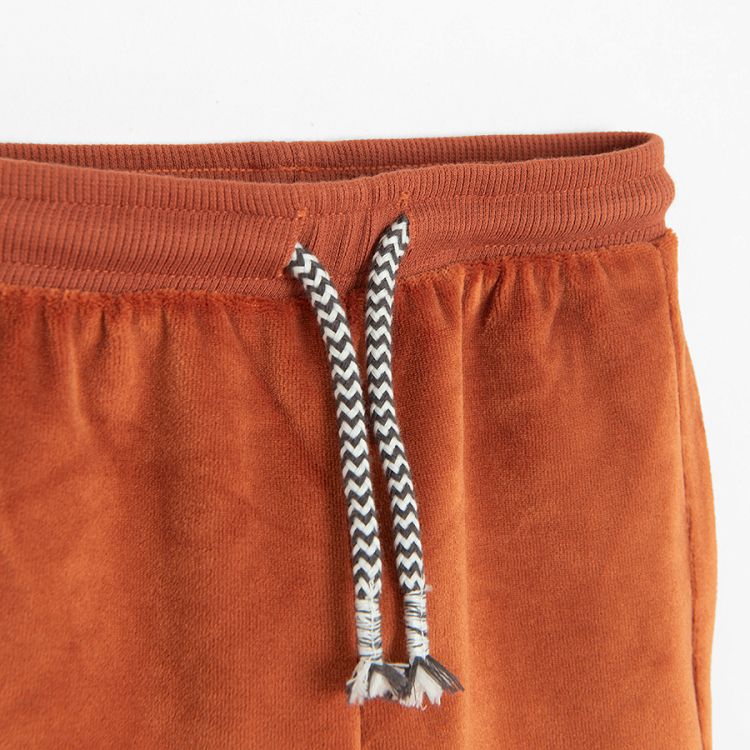 Brown jogging pants with bear print