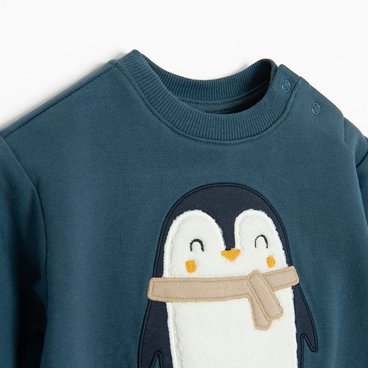 Blue long sleeve bodysuit with penguin print and brown footed leggings set