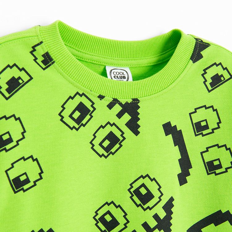 Lime sweatshirt with funny faces print