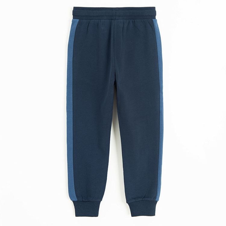 Blue sweatpants with stripe on the side and cord