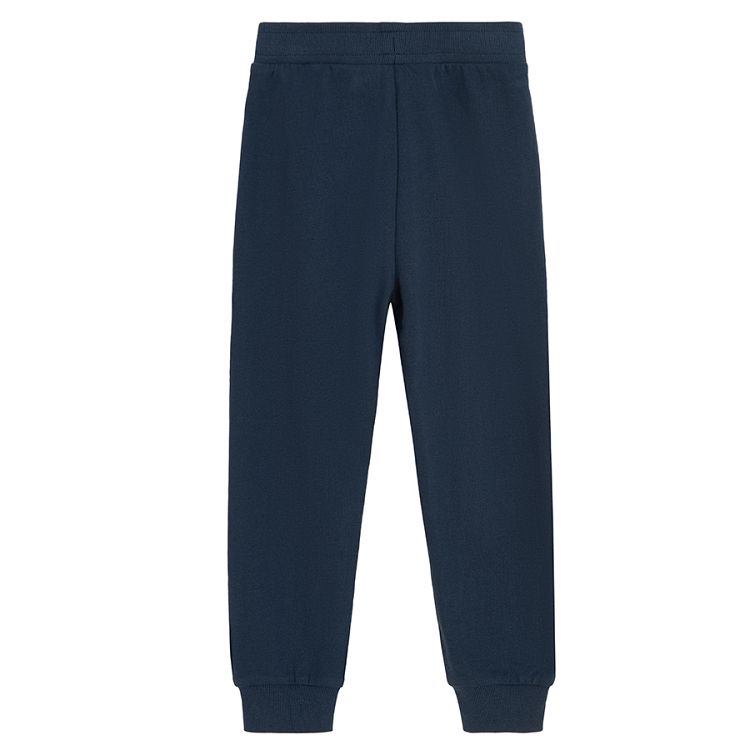 Blue jogging pants with corded waist and elastic around the ankles