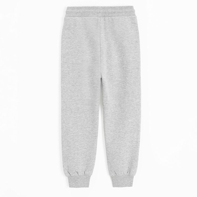 Grey jogging pants with design on the knees