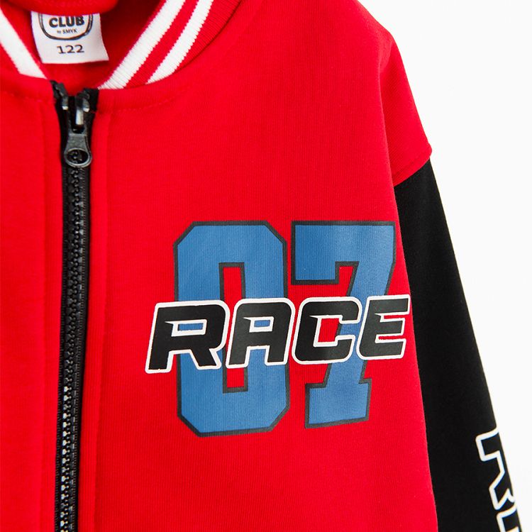 Red zip through sweatshirt with black sleeves and Race print