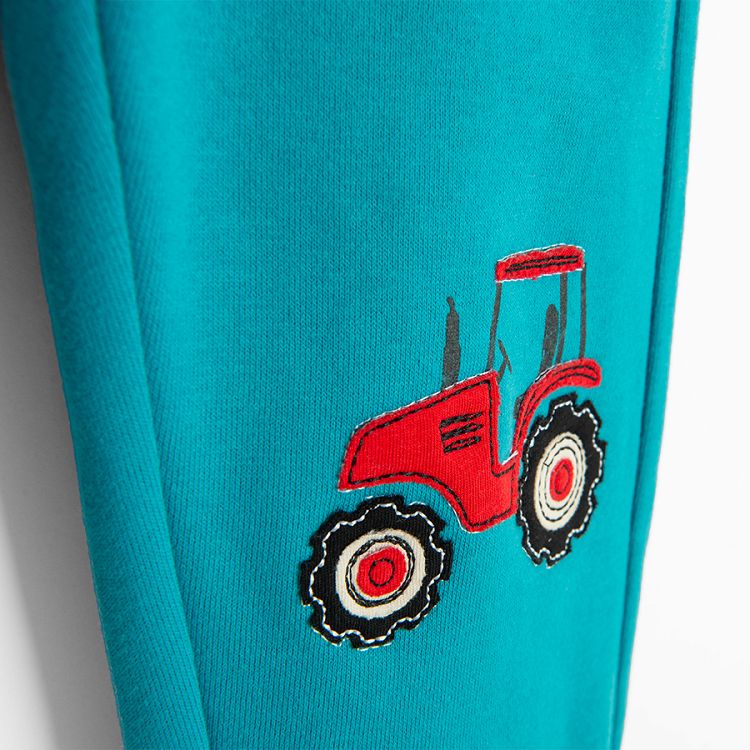 Light blue jogging pants with tractor print