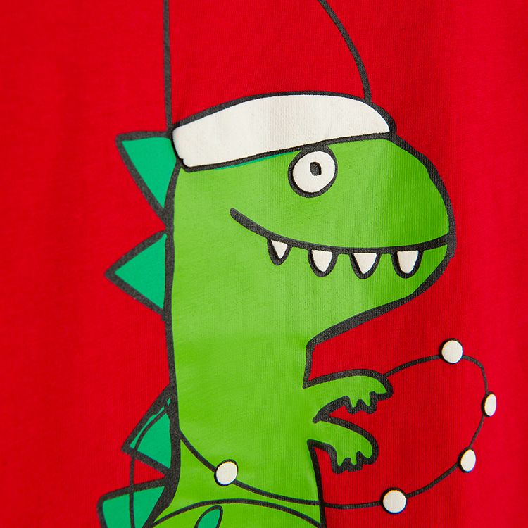 Red blouse with dinosaur weating Santa's hat