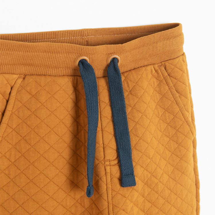 Brown and blue quilted jogging pants