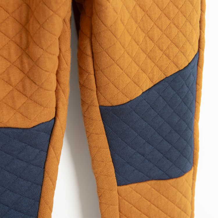 Brown and blue quilted jogging pants