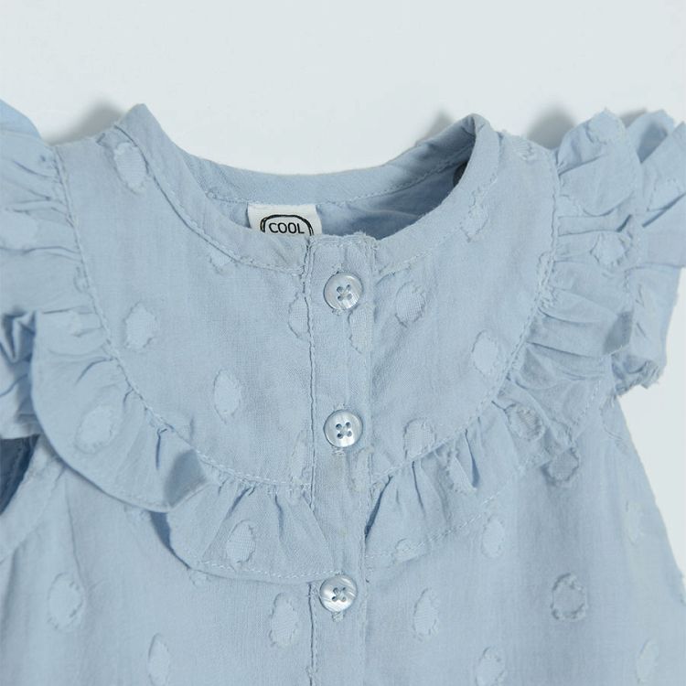 Light blue sleeveless shirt with ruffles around the neckline