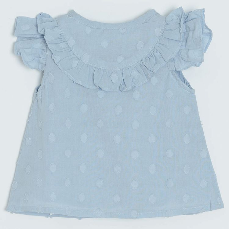 Light blue sleeveless shirt with ruffles around the neckline